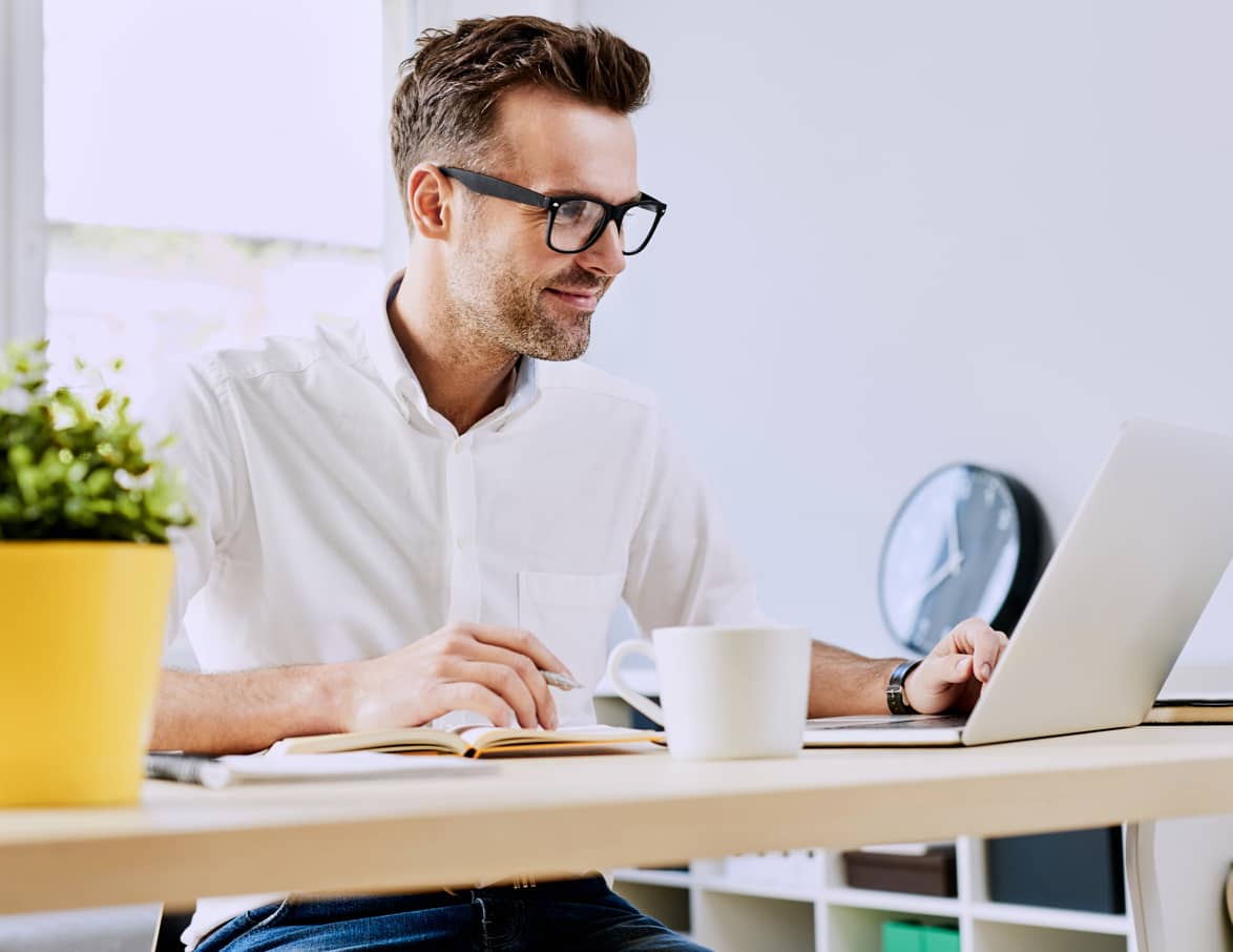 Man using laptop at desk
